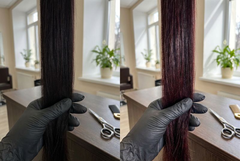The same dark cherry strand photographed under indoor artificial light and under direct natural light